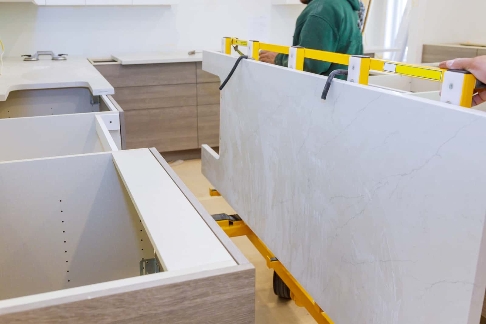 Granite countertops being installed in kitchen